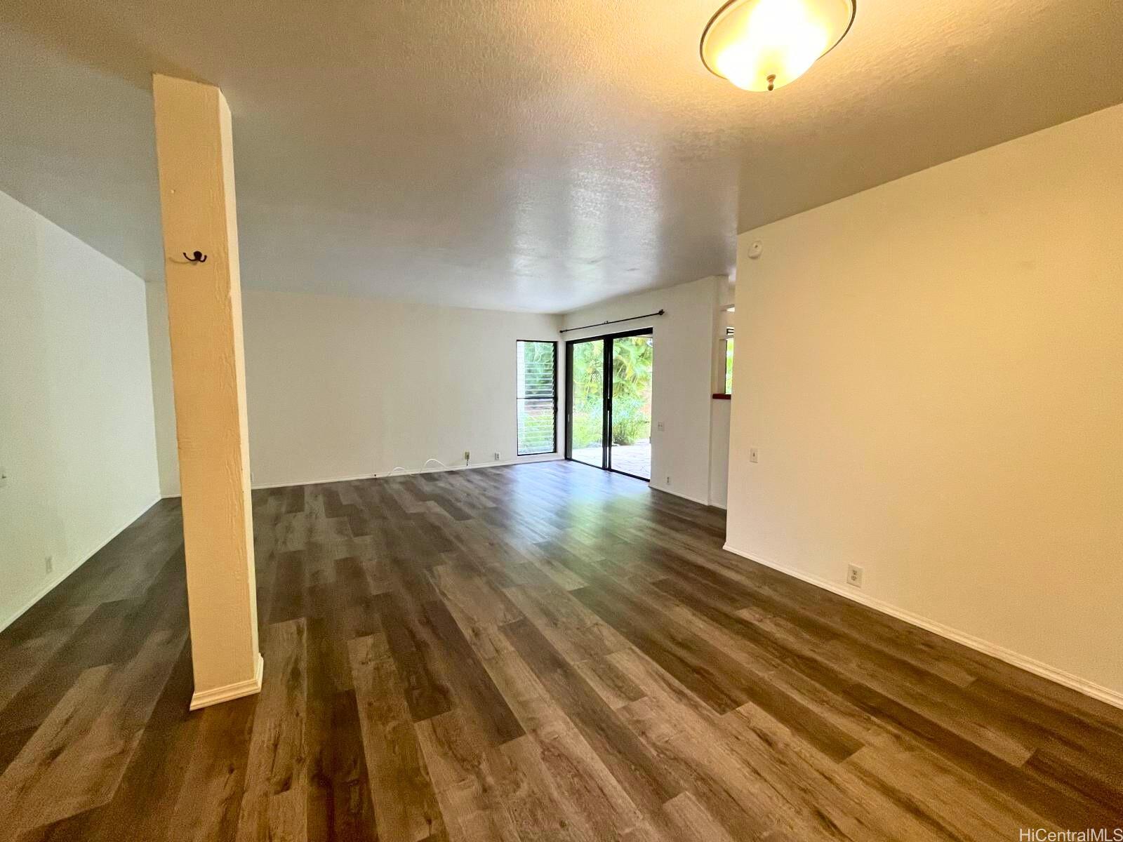 a view of hallway with wooden floor