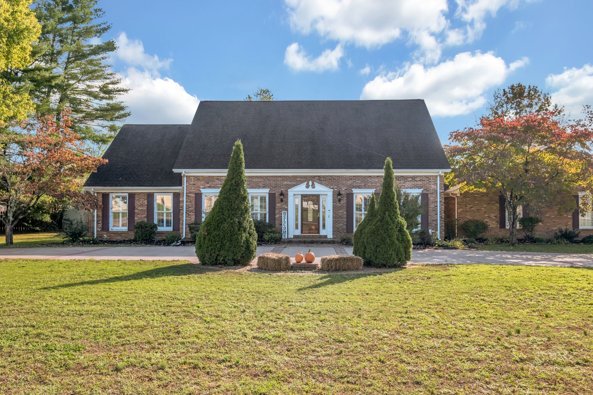 a front view of a house with a yard