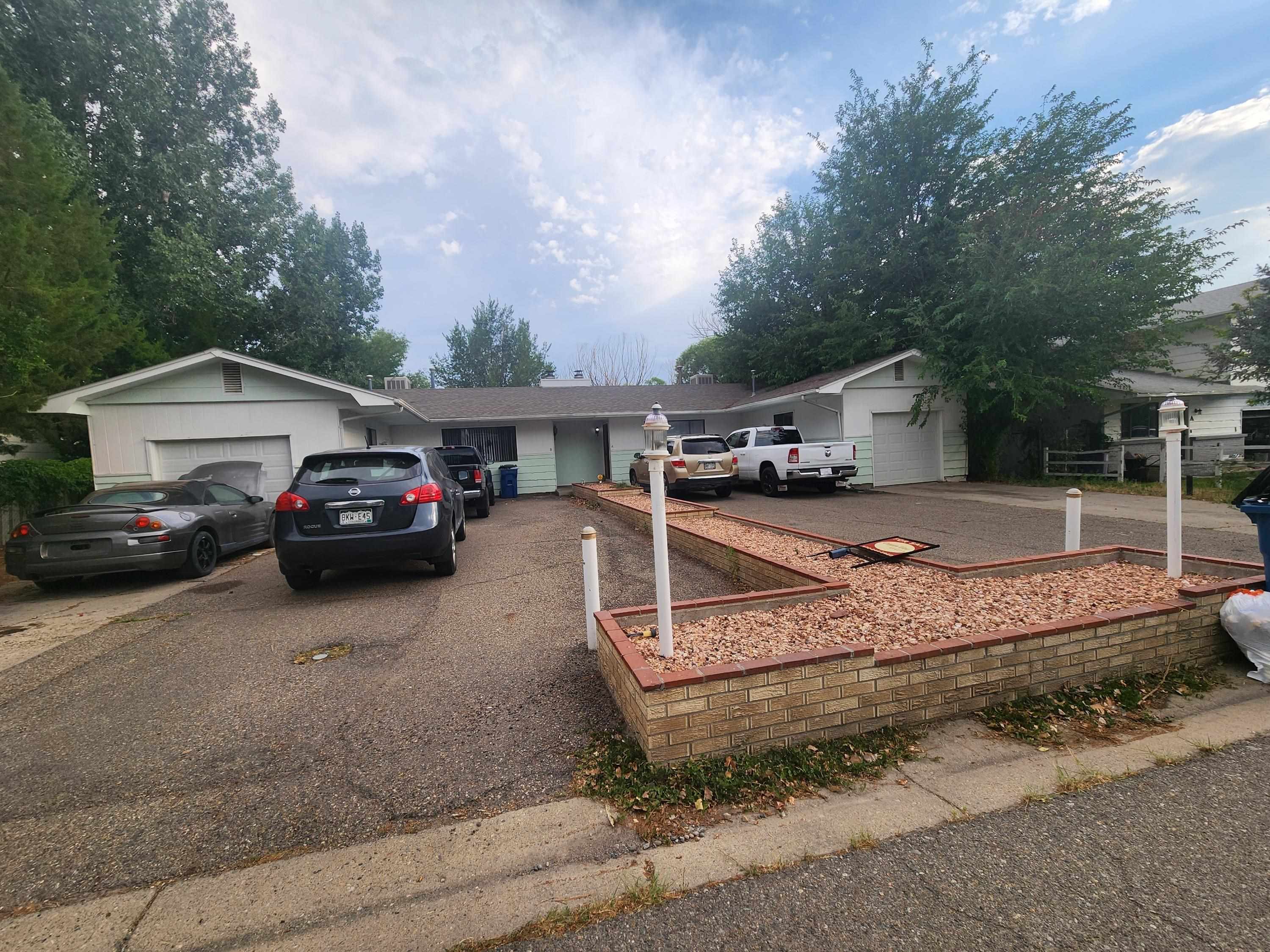 a view of a car park in front of house