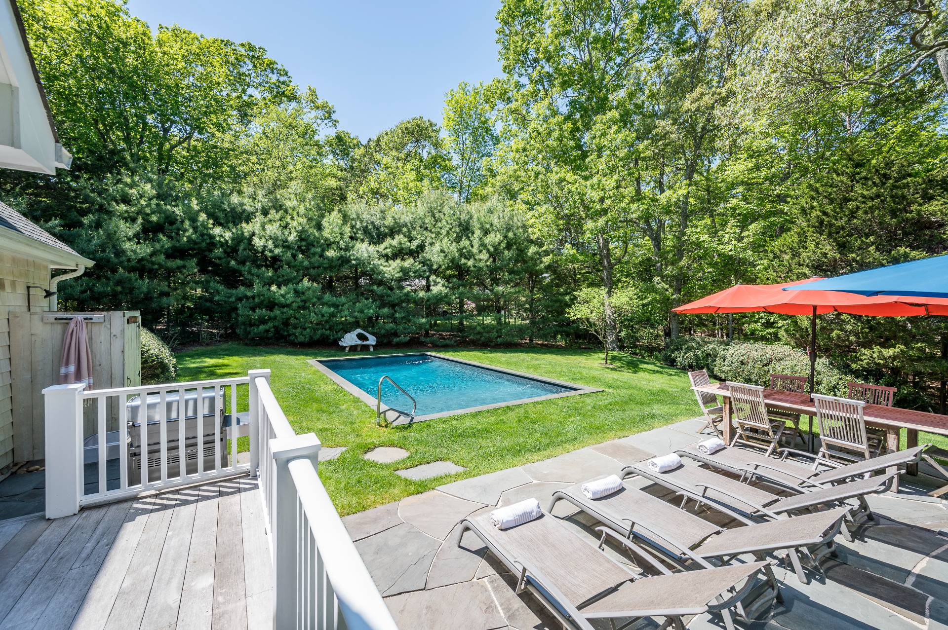 a view of a wooden deck and a patio