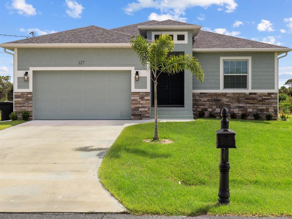 a front view of a house with a yard