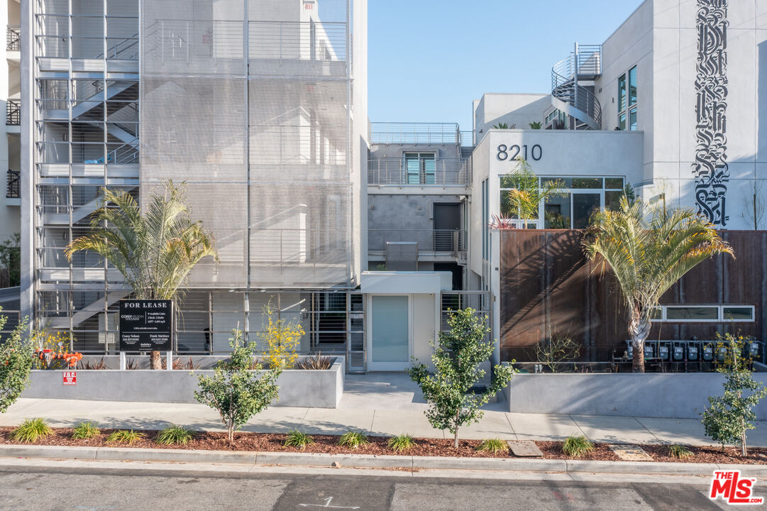 a front view of a multi story residential apartment building