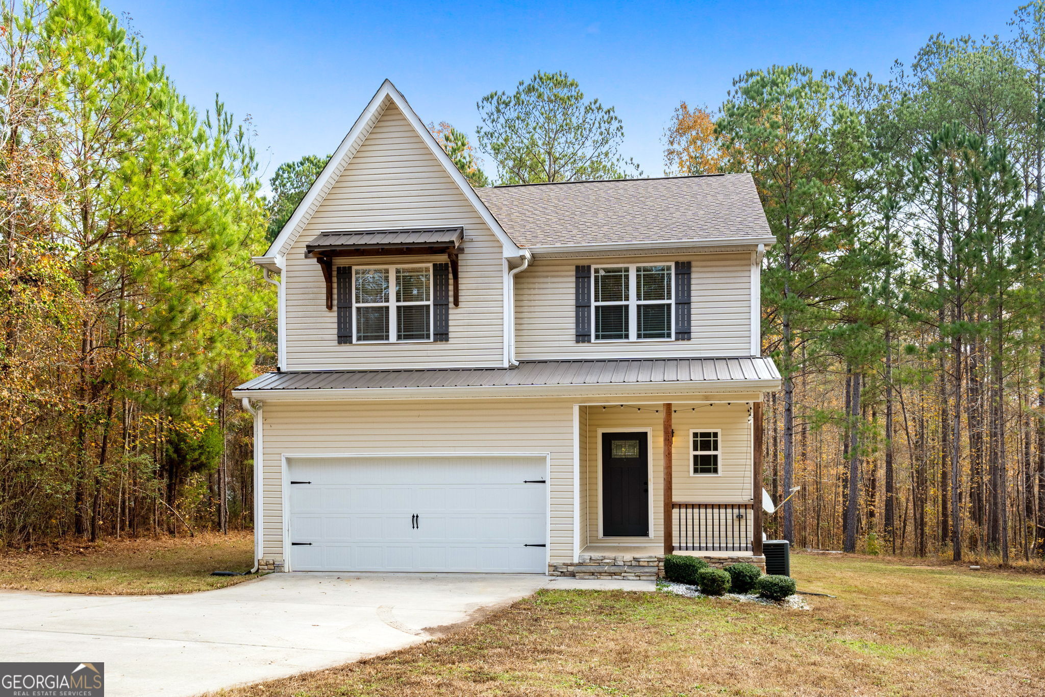 front view of a house with a yard