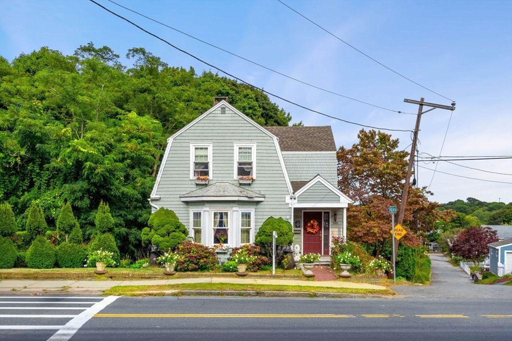 a front view of a house with a yard