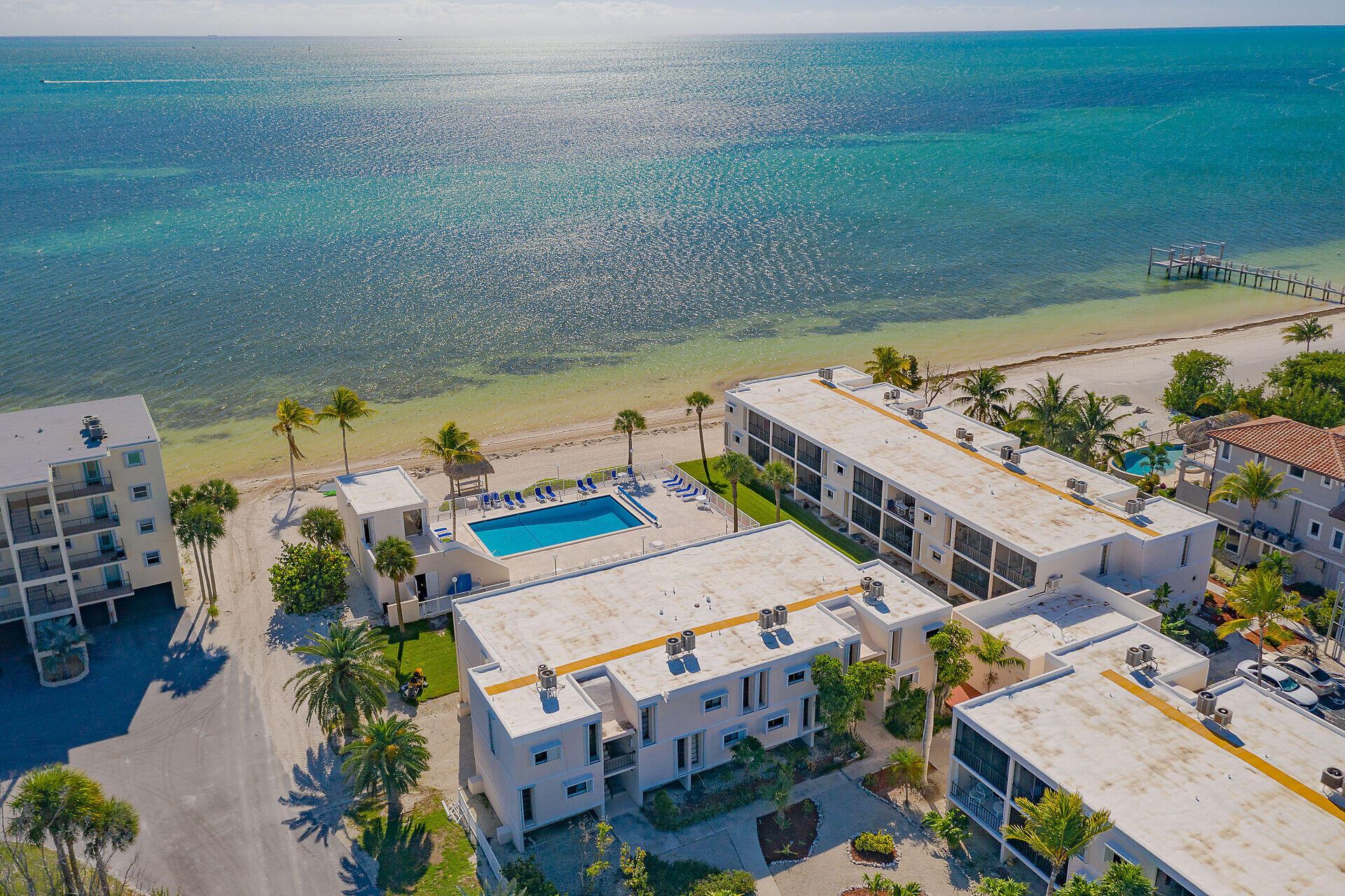 an aerial view of a house with a ocean view