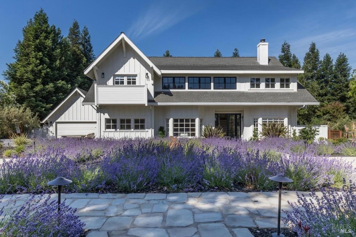 a front view of a house with garden