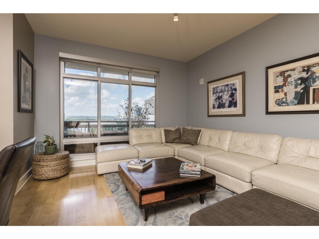 a living room with furniture and a large window