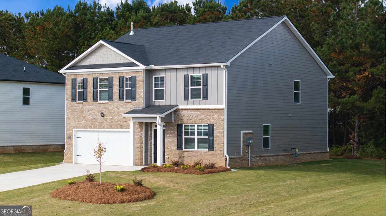 a front view of a house with a yard