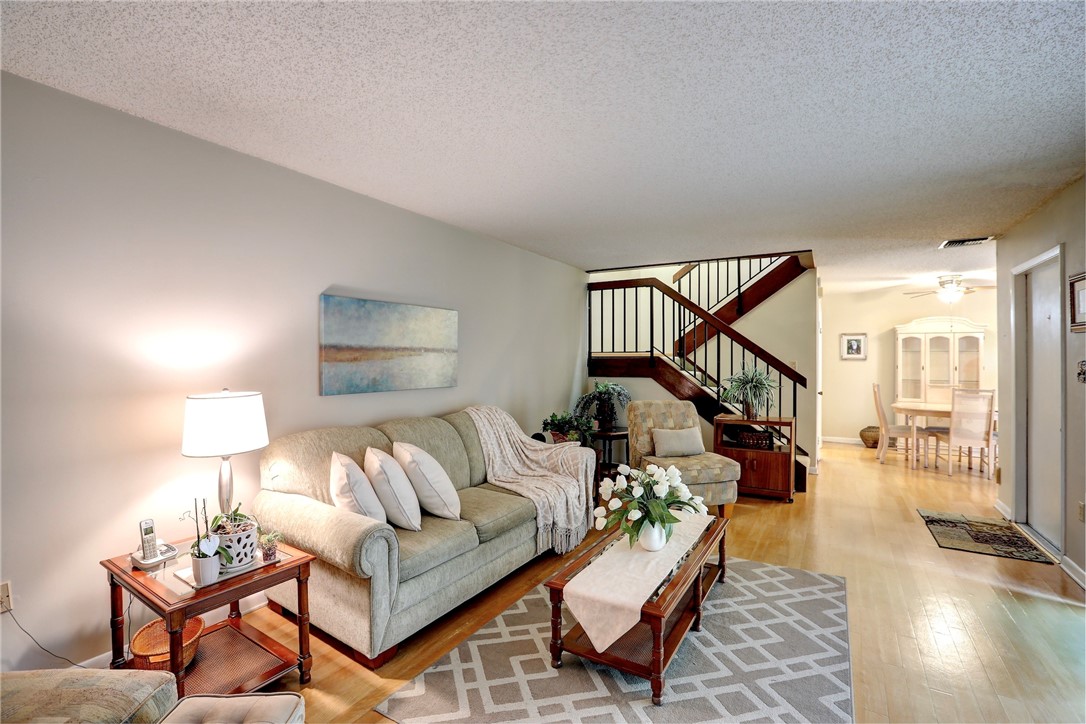 a living room with furniture and a table