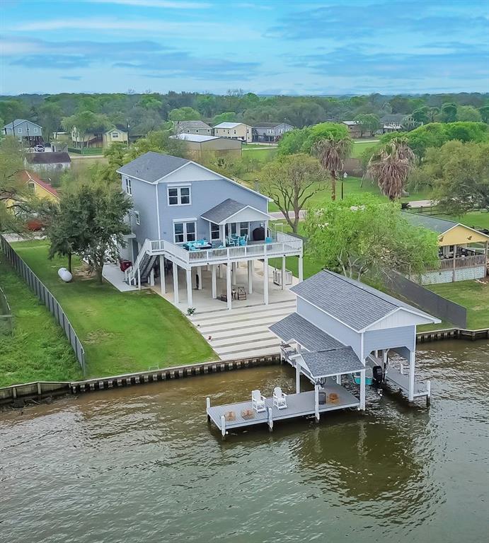 an aerial view of a house with a ocean view