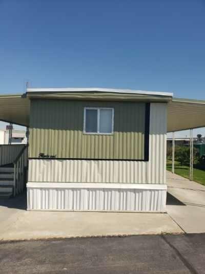 a view of a house with a wooden fence