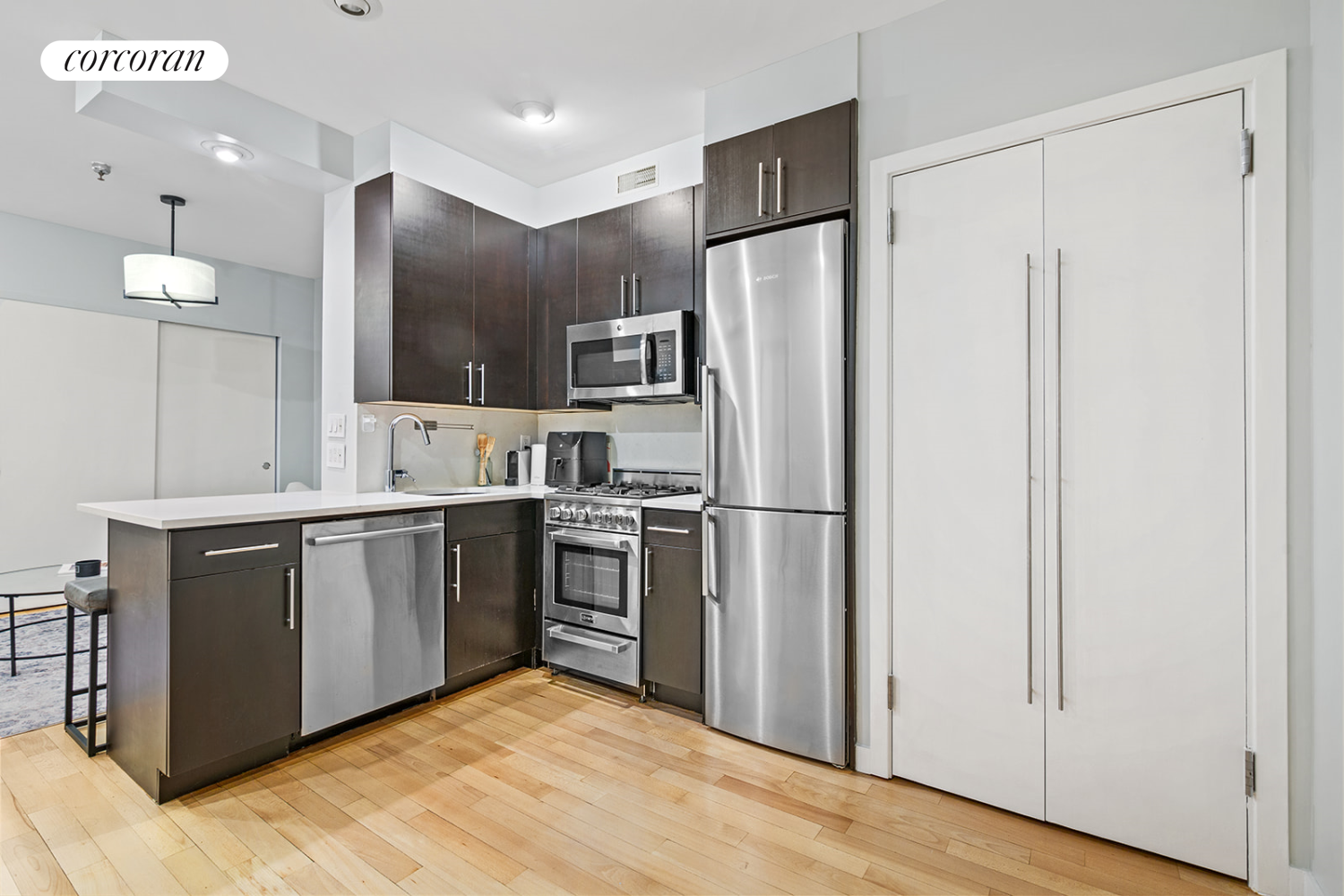 a kitchen with stainless steel appliances a refrigerator and a sink