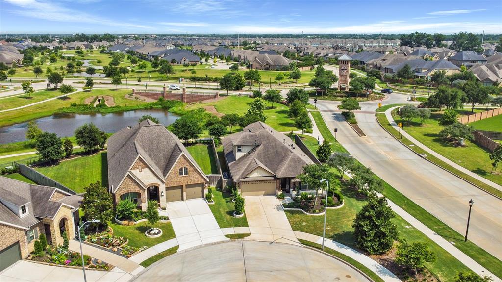 an aerial view of a house with a lake view