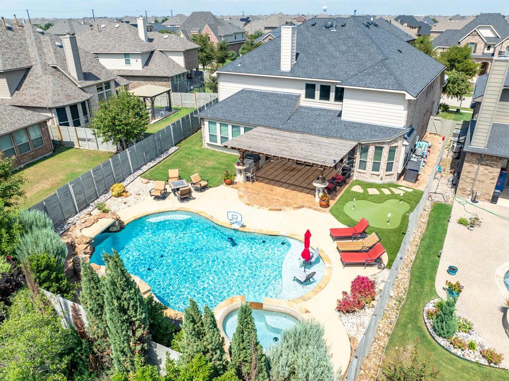 an aerial view of a house with outdoor space