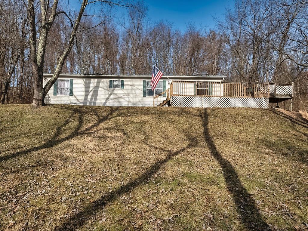 a view of house with trees in the background