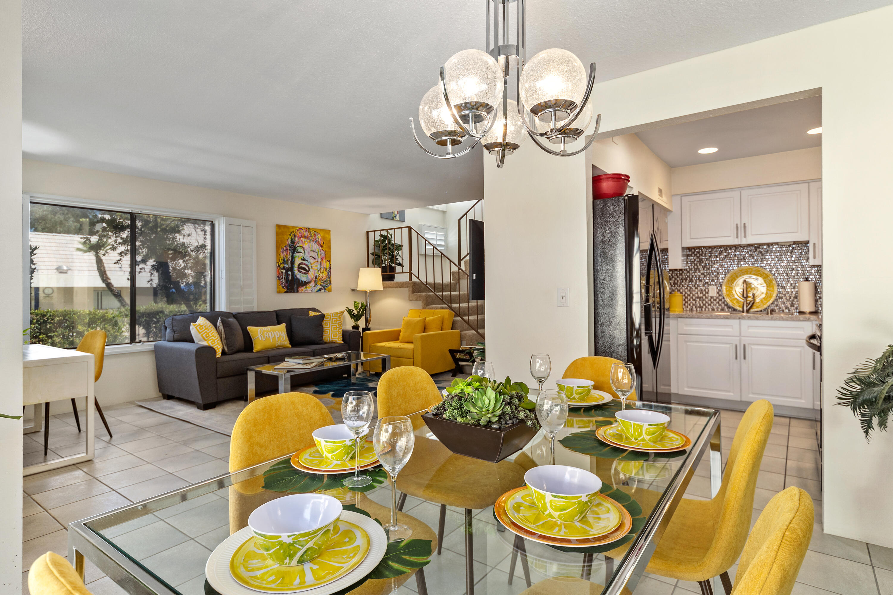 a living room with dining table and wooden floor