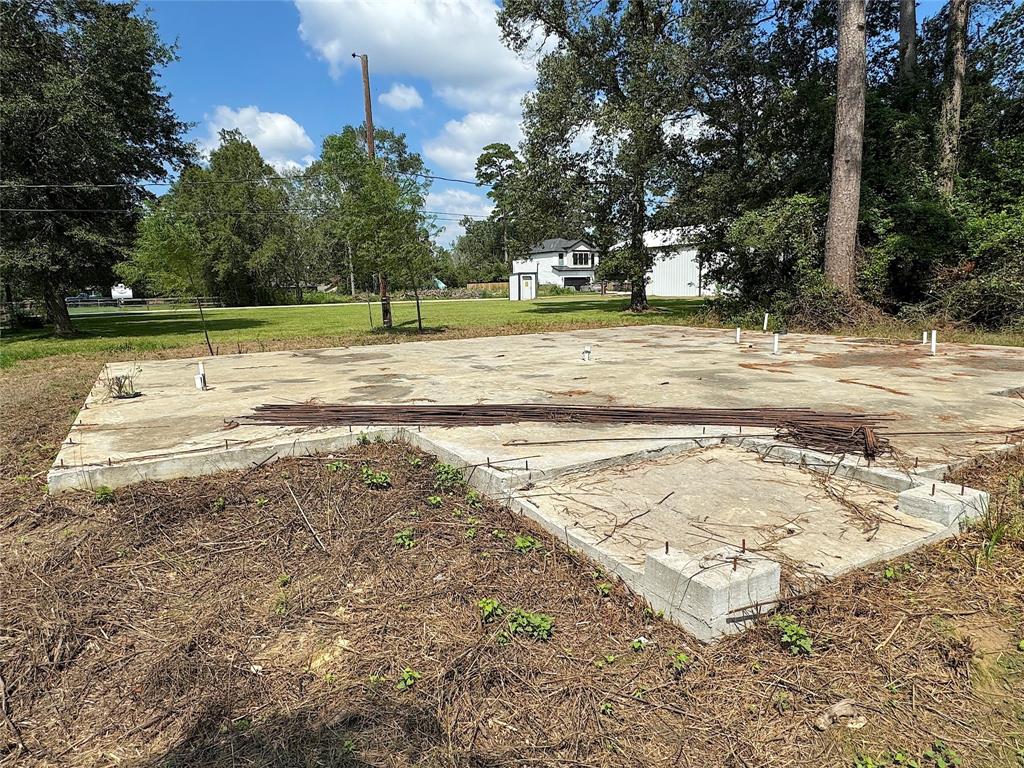 a view of a swimming pool with a yard