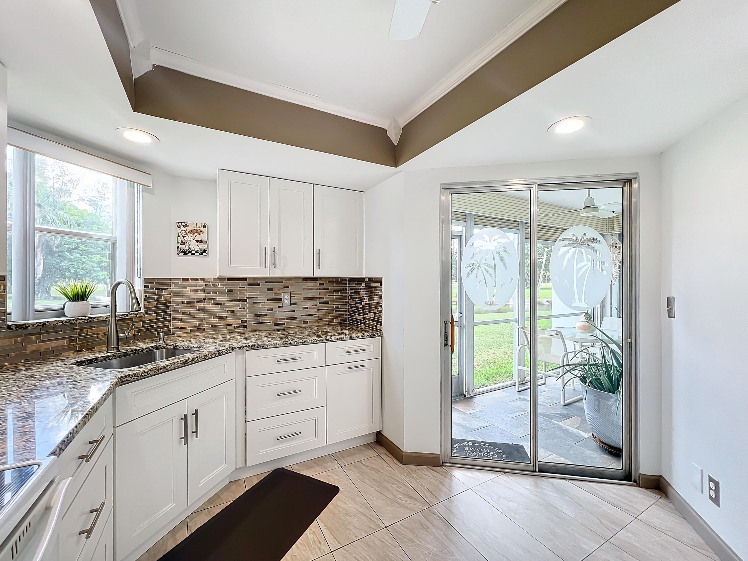 a kitchen with sink and cabinets