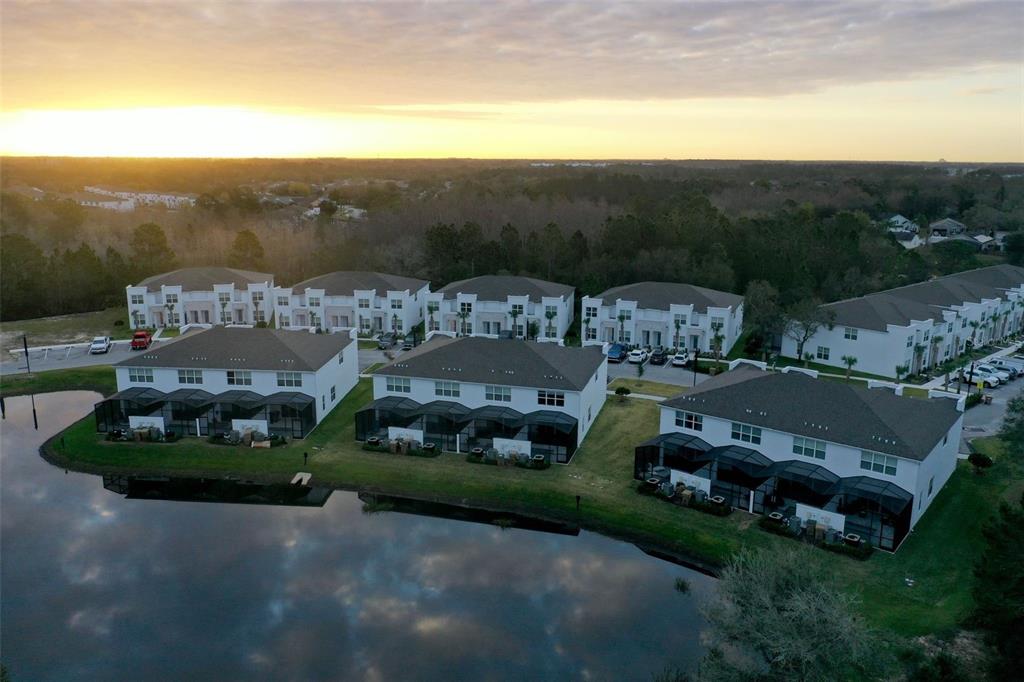 a view of houses with outdoor space and city view