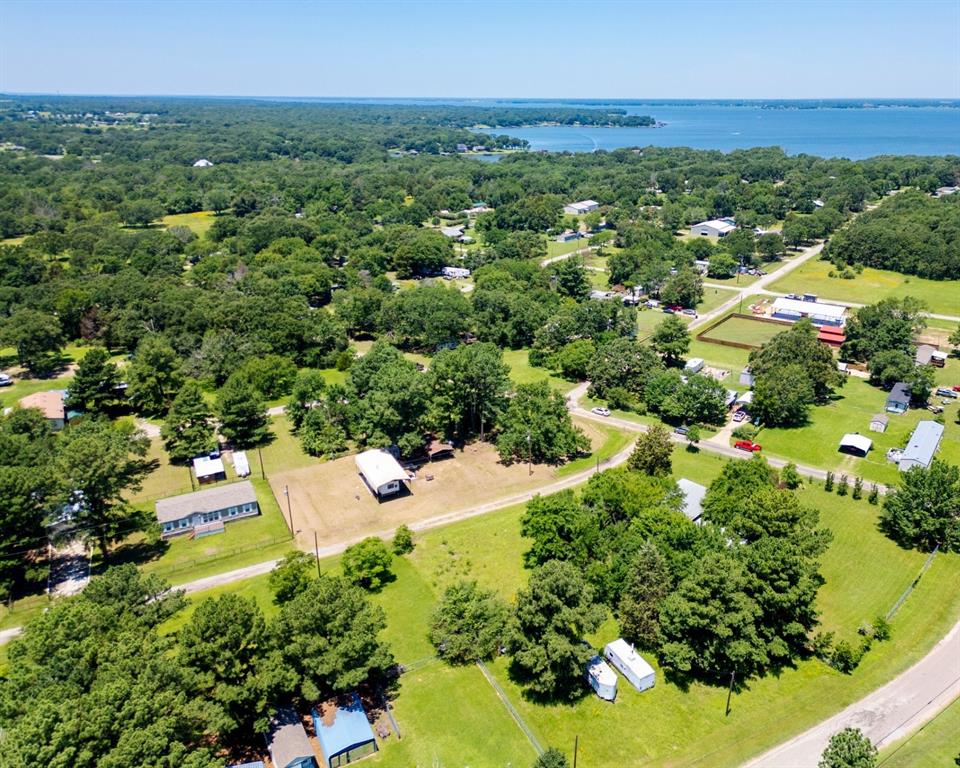 an aerial view of a houses with a yard