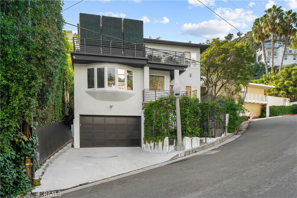 a front view of a house with a garage