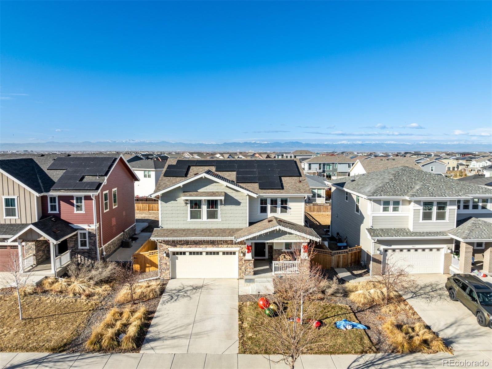 an aerial view of a house with a big yard