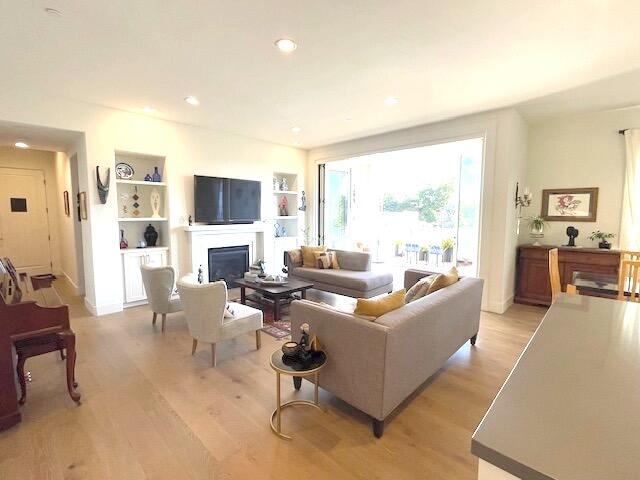 a living room with fireplace furniture and a flat screen tv