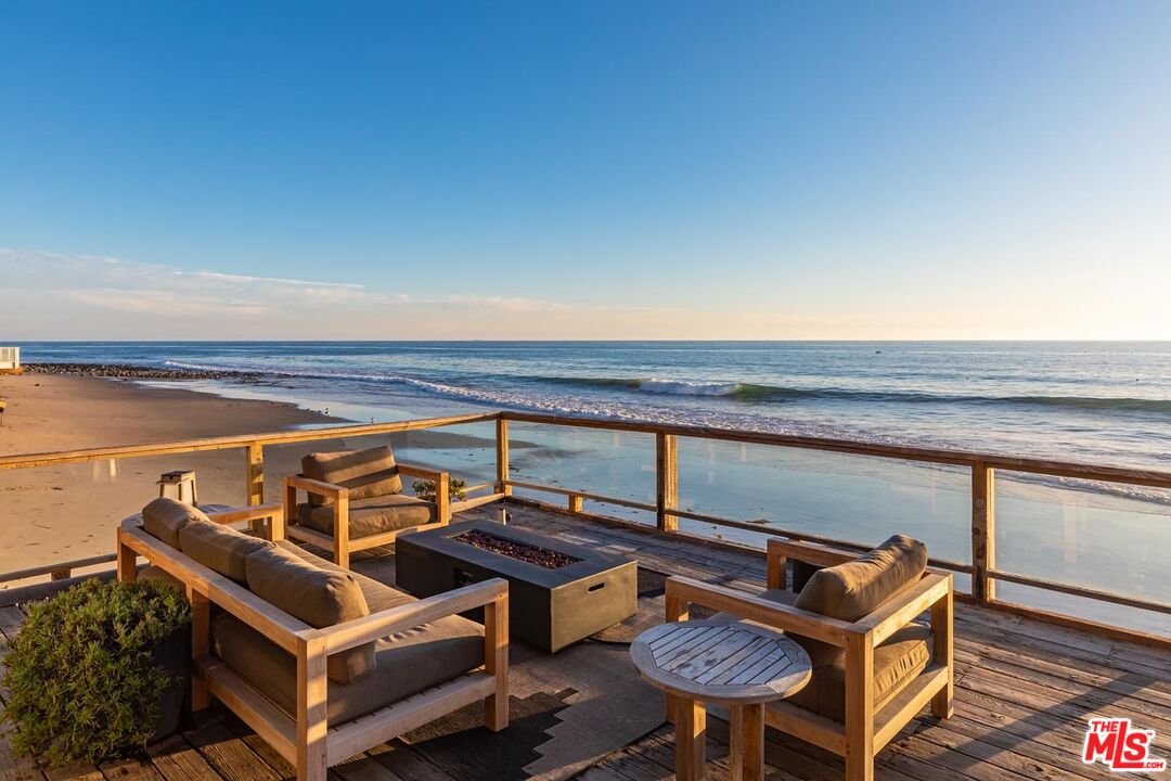 a view of a chairs and table on the terrace