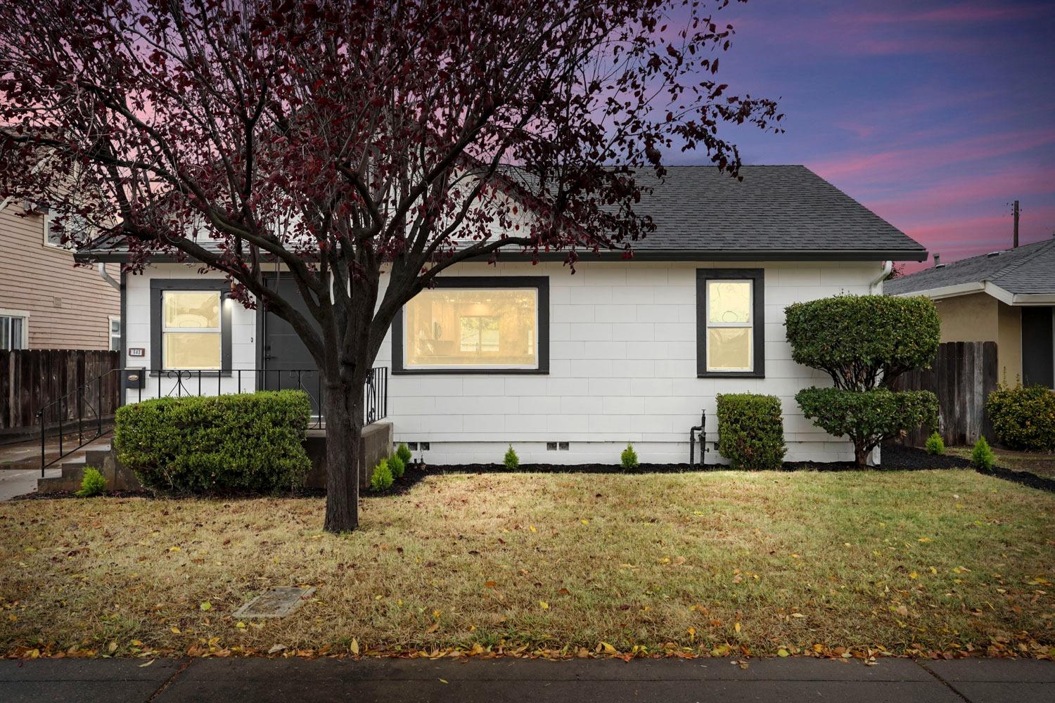 a front view of a house with a yard