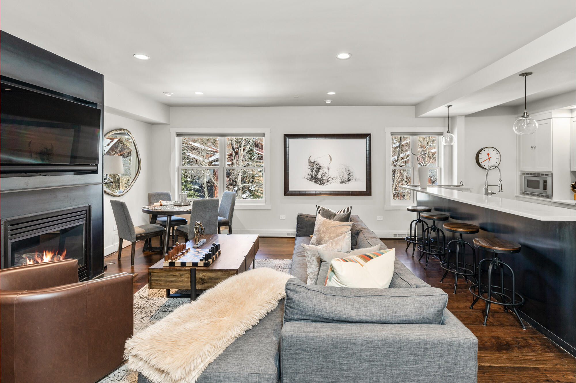 a living room with fireplace furniture and a flat screen tv