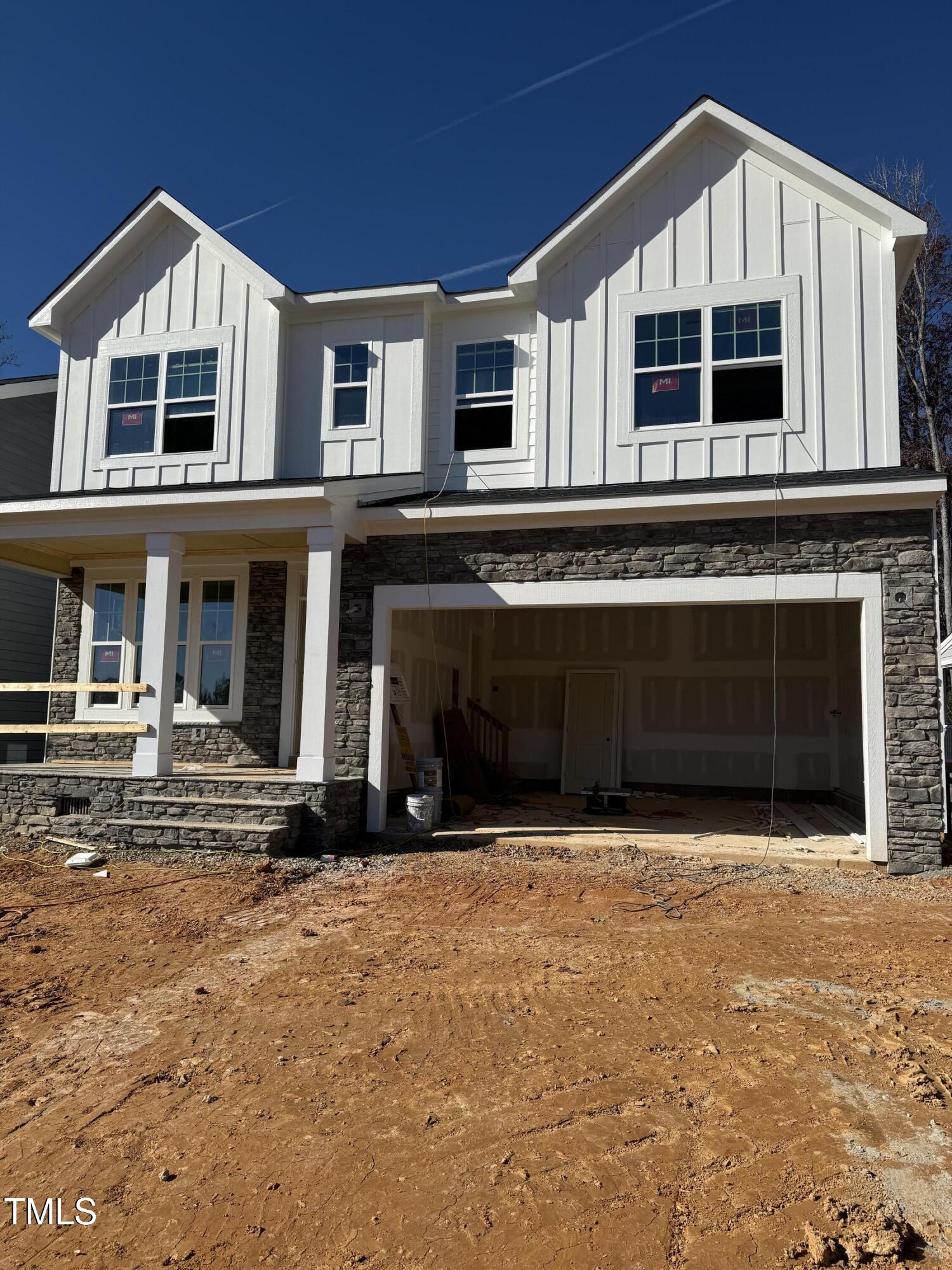 a front view of a house with yard