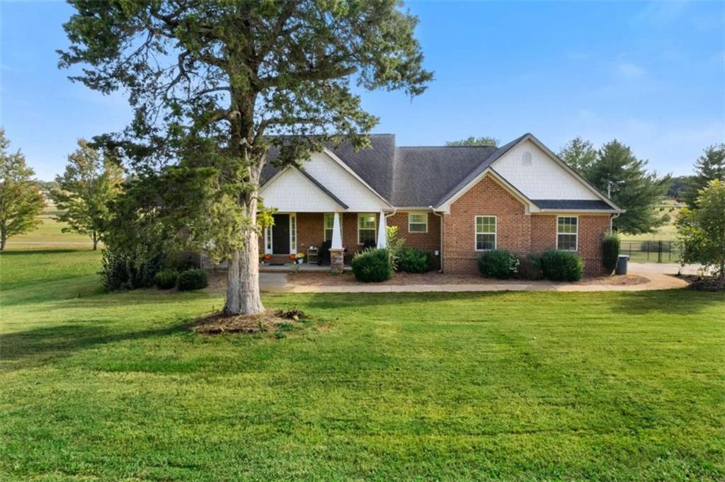 a front view of a house with a yard