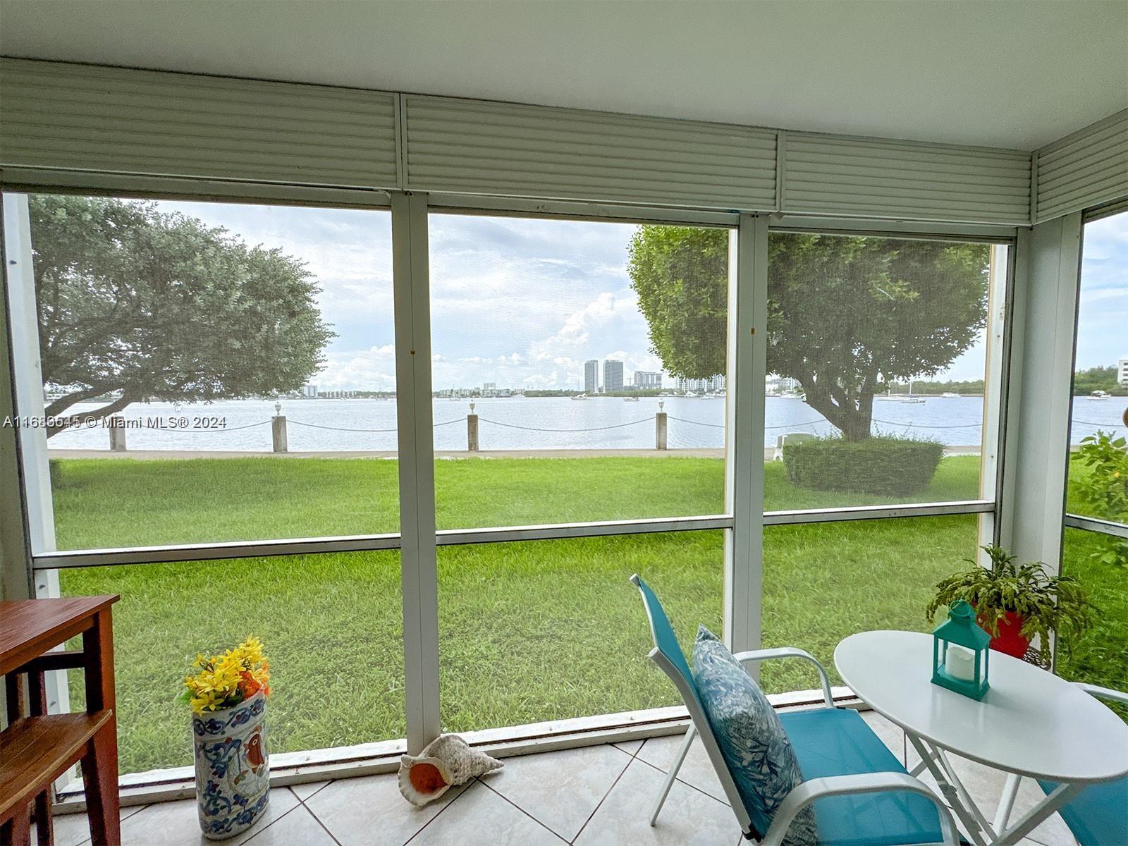 a view of a floor to ceiling window and a table