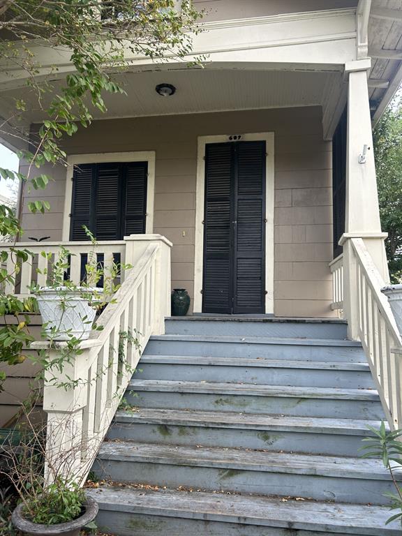 609 Church has not flooded. True shotgun cottage floor plan. Original front door shutters.