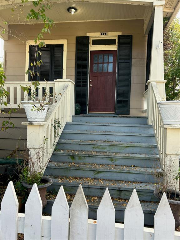 609 Church has not flooded. True shotgun cottage floor plan. Original front door shutters.