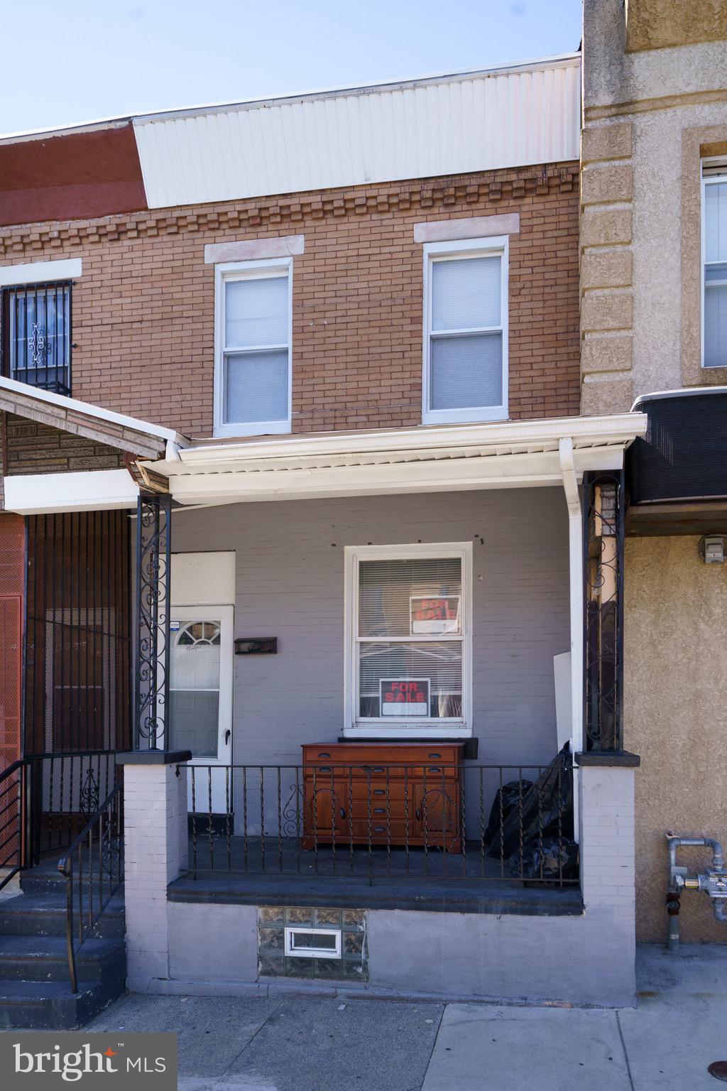 a front view of a house with parking