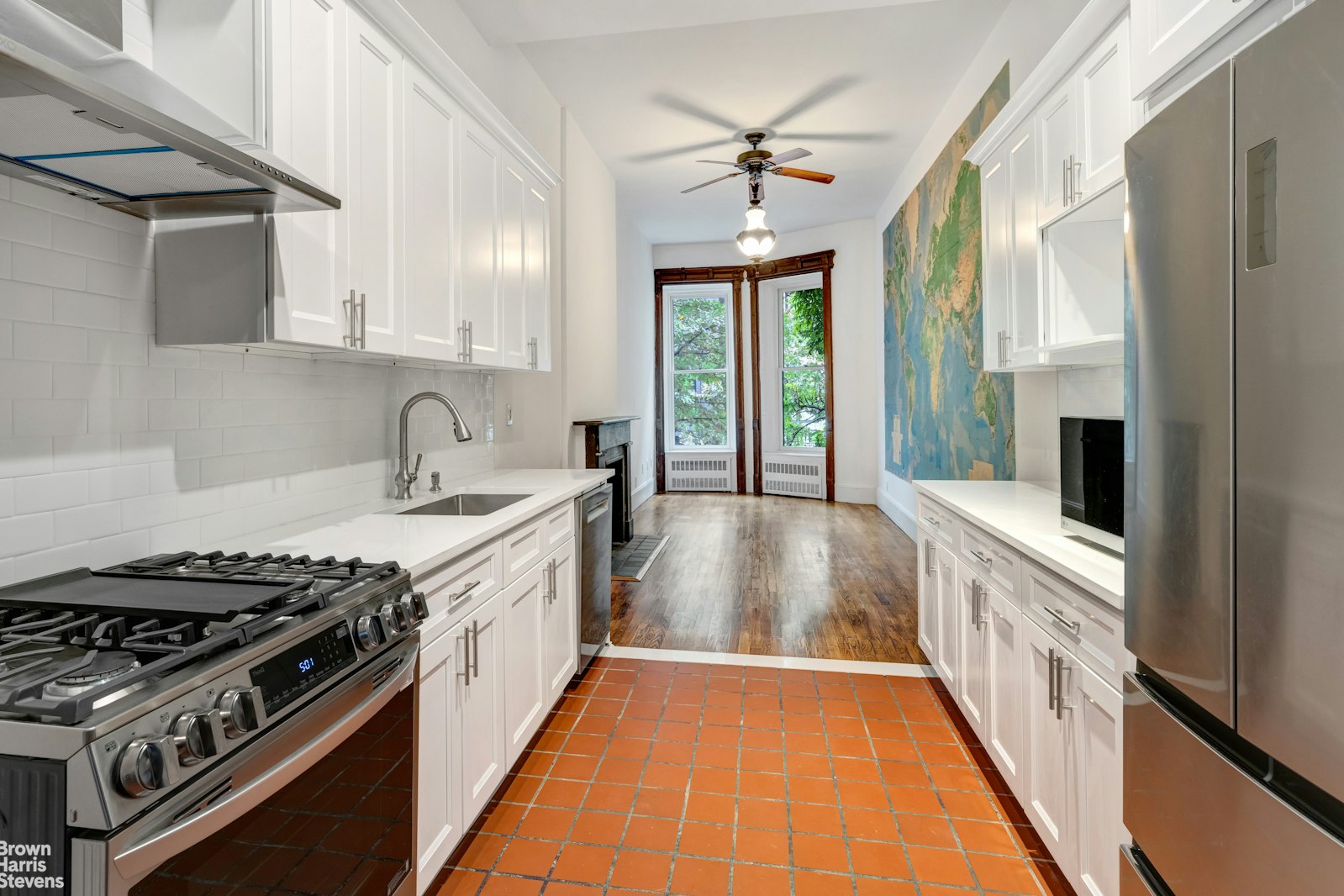 a kitchen with stainless steel appliances granite countertop a stove and a sink