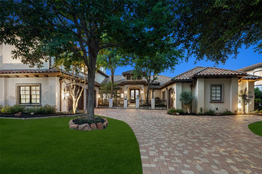 a front view of a house with a yard and porch