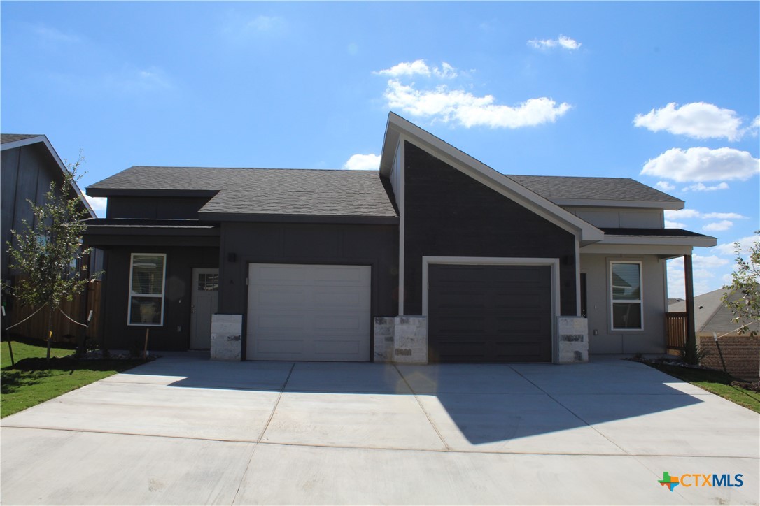 a front view of a house with a garage