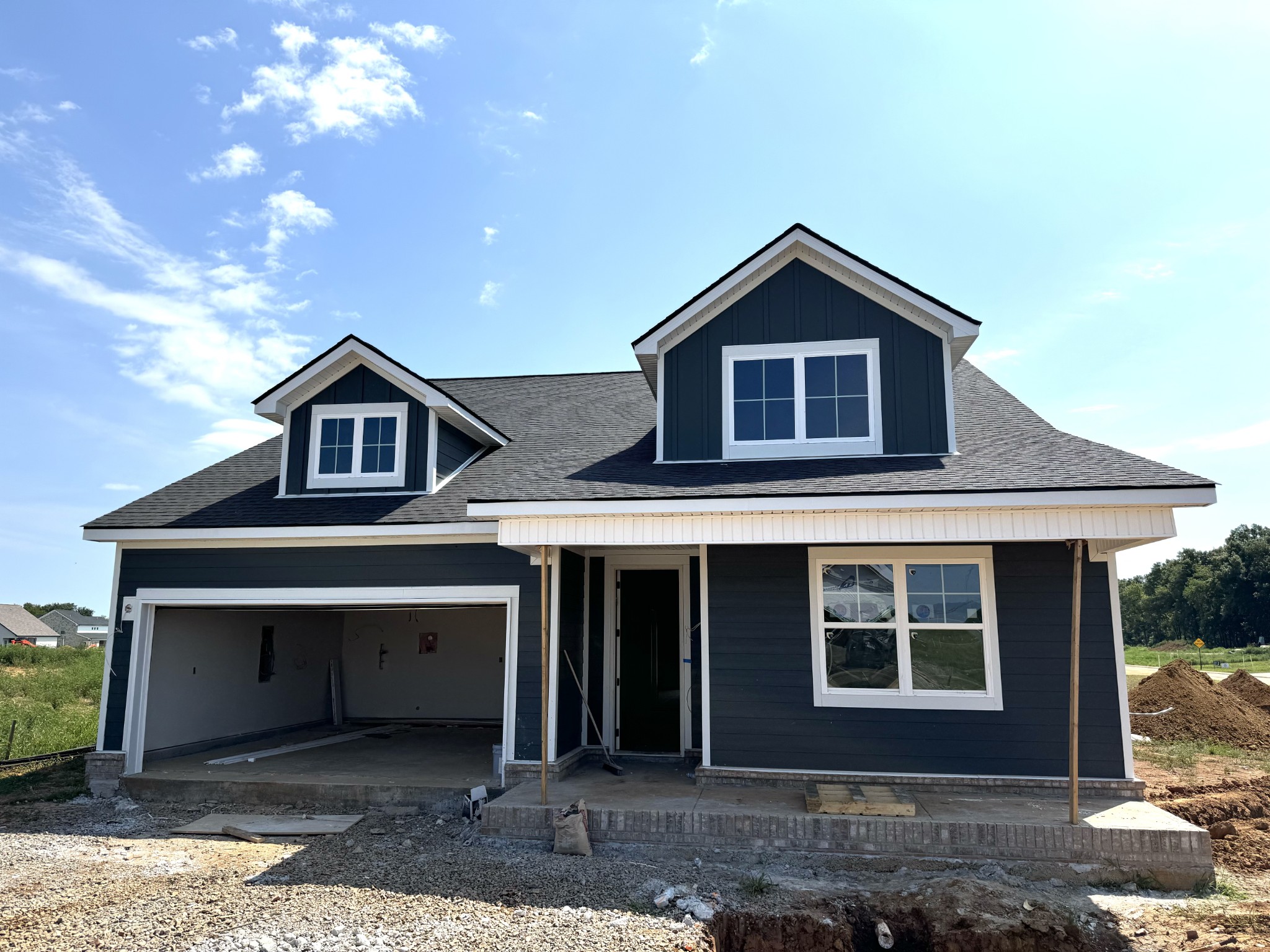 a front view of a house with yard