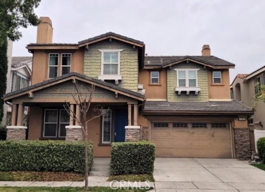 a front view of a house with garage