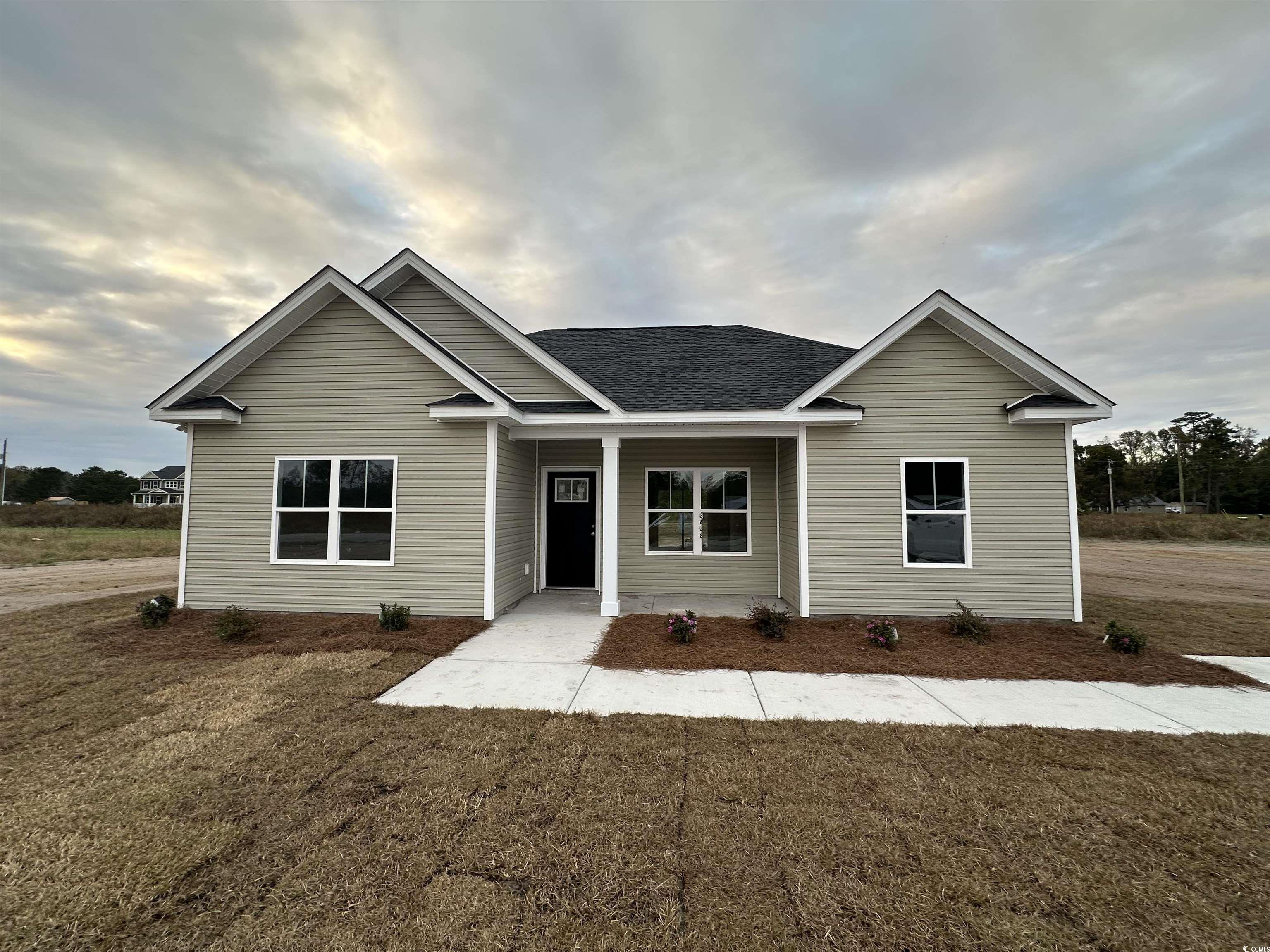 View of front of house featuring a front lawn