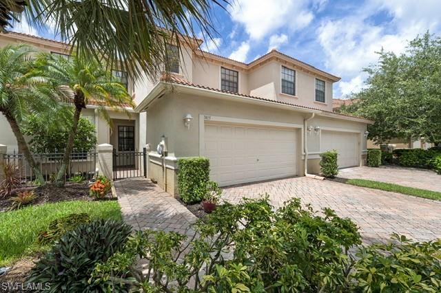 Mediterranean / spanish house featuring a garage