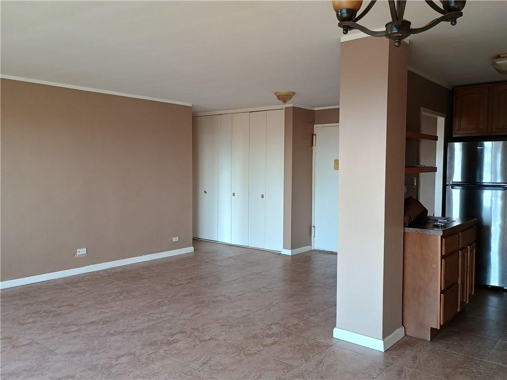 a view of an empty room with a fan