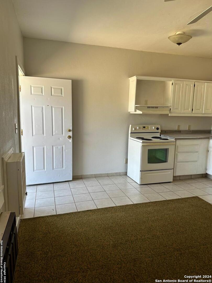 a kitchen with stainless steel appliances a stove a sink and a refrigerator