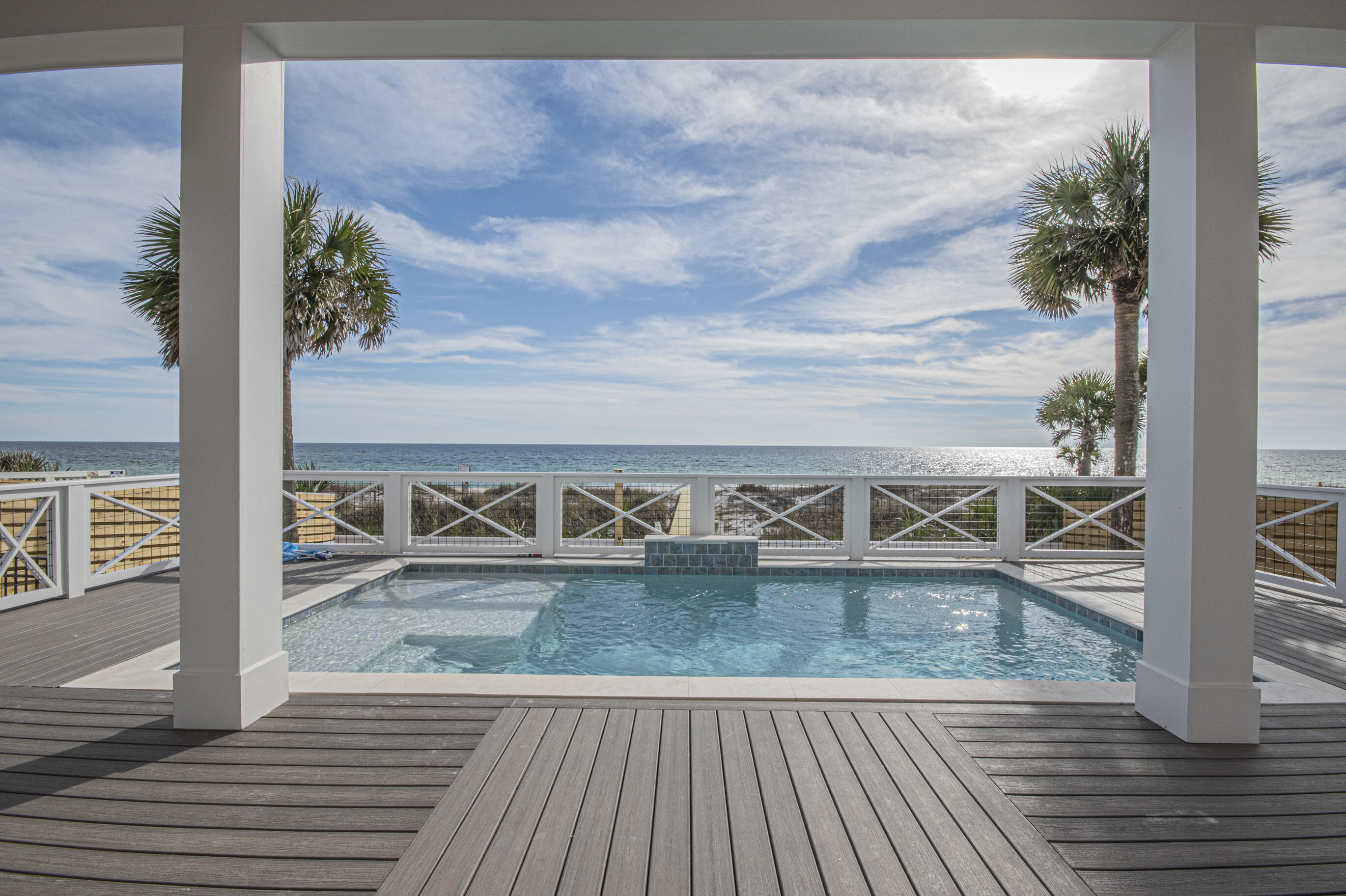 a view of a balcony with wooden floor