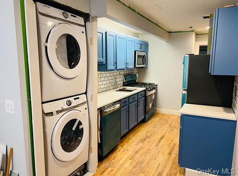 a view of a kitchen with washer and dryer