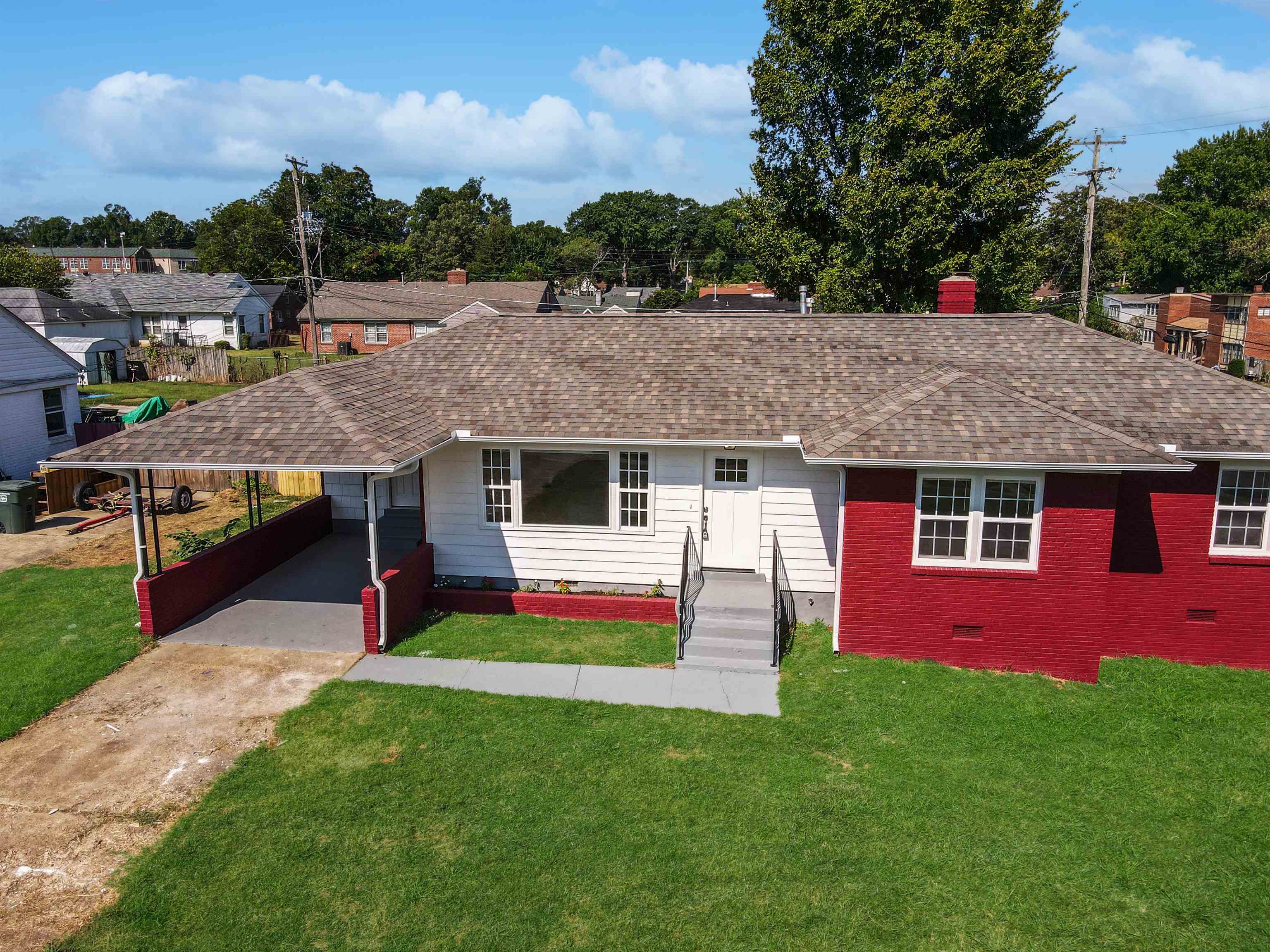 a aerial view of a house with a yard