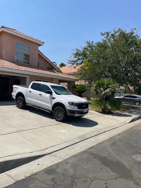 a view of a car parked in front of a house