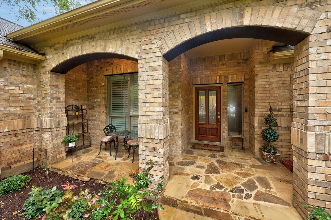 Welcome to 505 Autumn Bend, covered front porch and walkway capped with flagstone rock